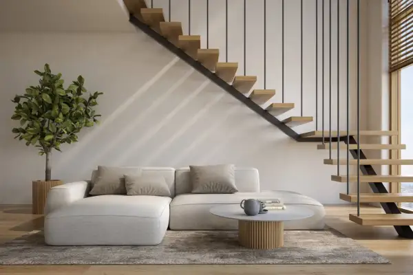 Nowoczesne schody otwarte na salon, z drewnianymi stopniami i metalową balustradą, tworzą lekkość i przestrzeń.